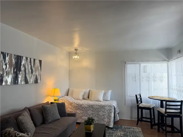 a view of a room with a table and chairs