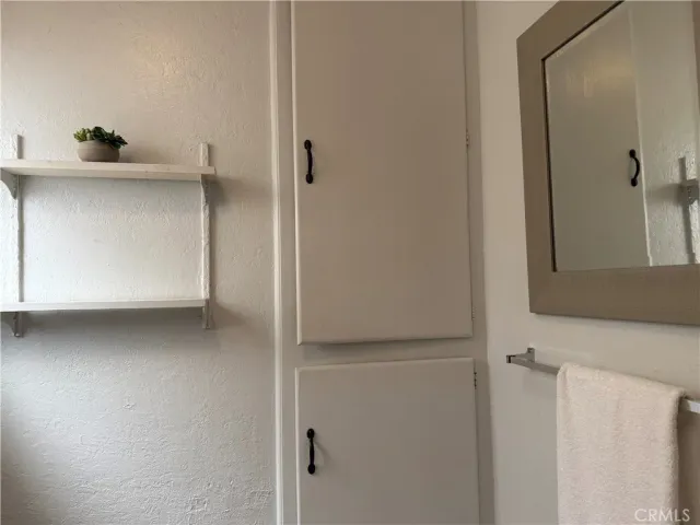 a bathroom with a sink and vanity
