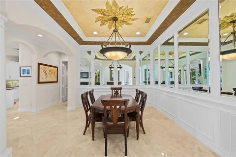 a view of a a dining room with furniture window and outside view