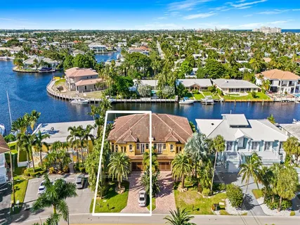 an aerial view of a house with a ocean view