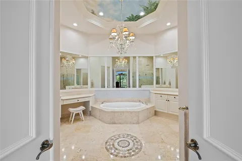 a spacious bathroom with a toilet sink and mirror