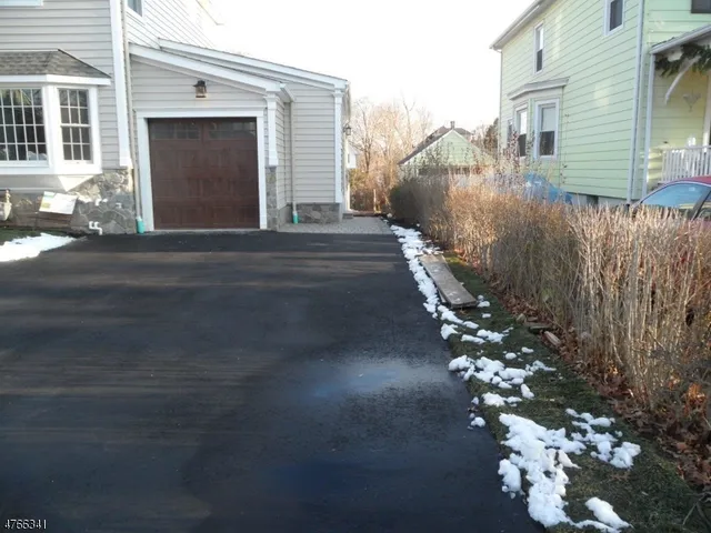 a view of a house with a street