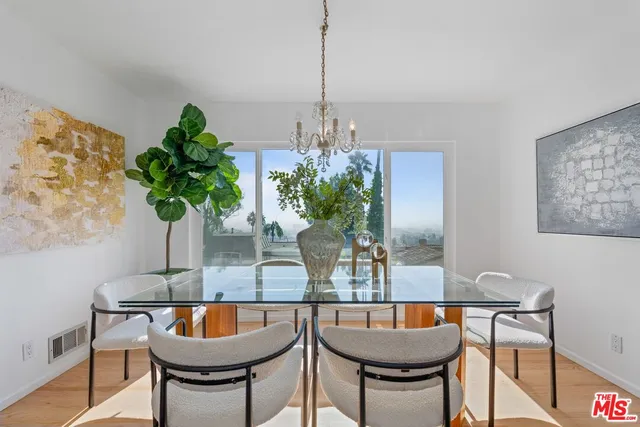 a dining room with table and chairs