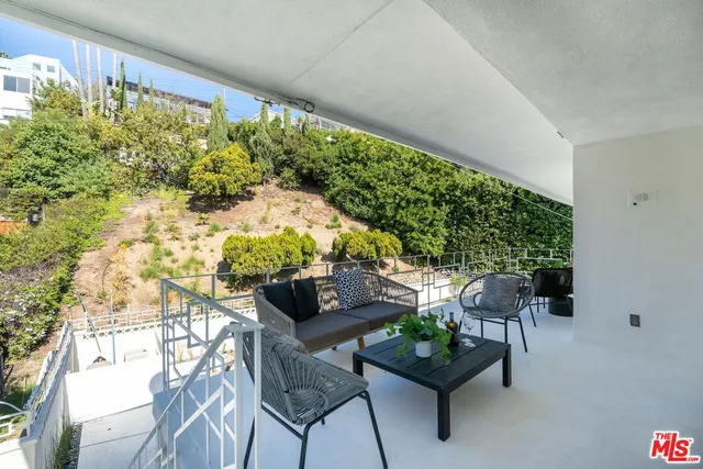 a backyard with table and chairs