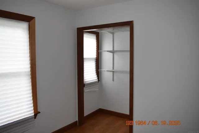 a view of front door with wooden floor