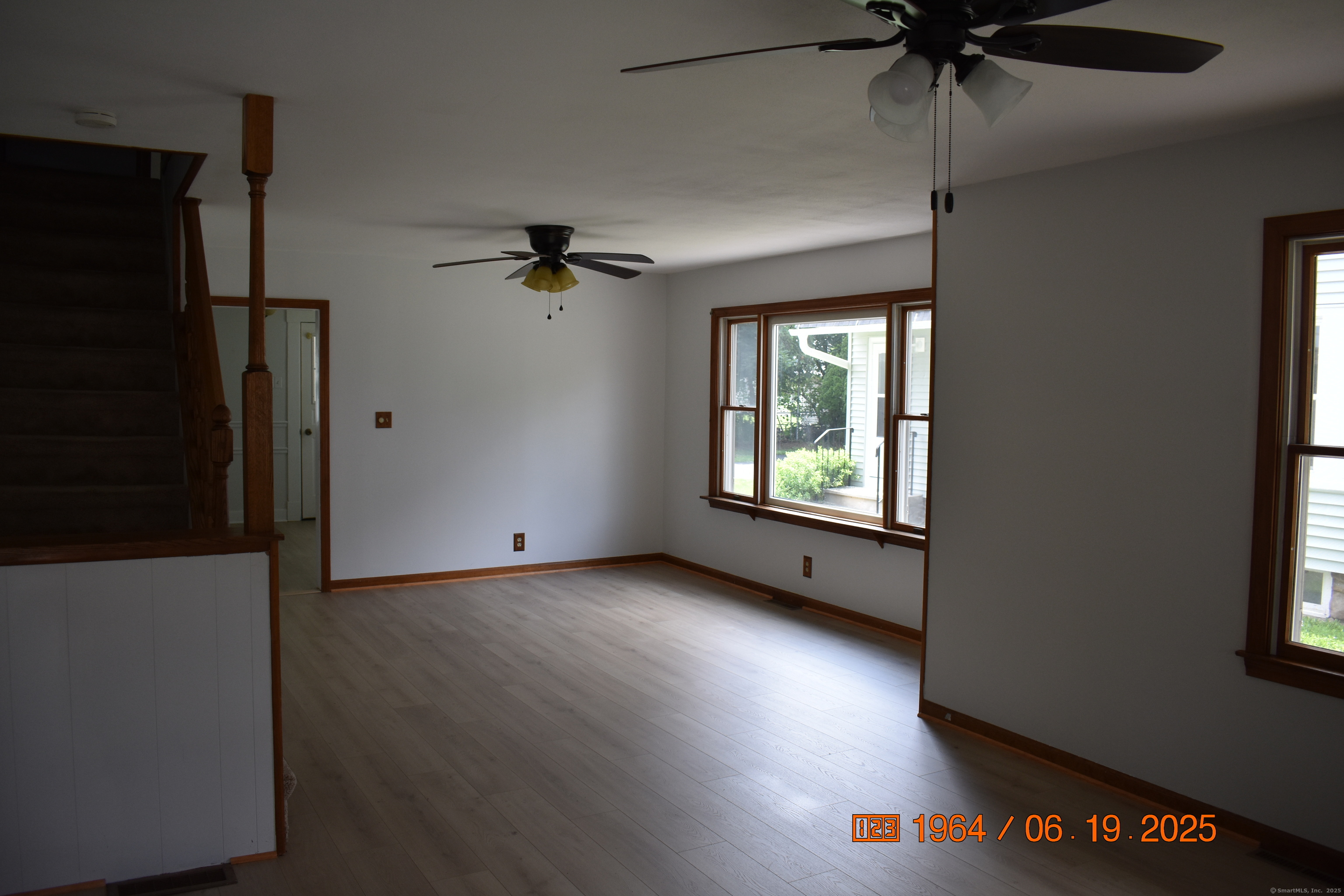 39 Highland Avenue Beacon Falls, CT 06403 - Photo 3 of 17 an empty room with windows and fan