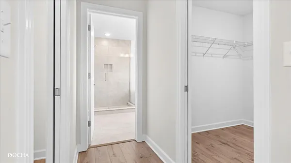 a view of bathroom with wooden floor