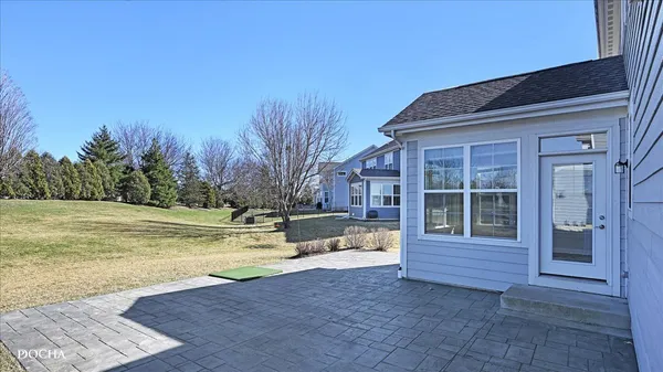 a view of a house with a swimming pool with a yard