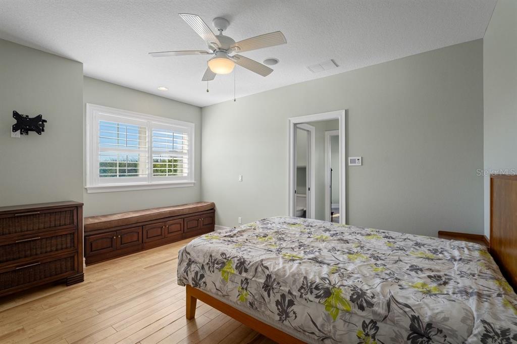 2 Mar Azul North Ponce Inlet, FL 32127 - Photo 40 of 98 a bedroom with a bed and wooden floor