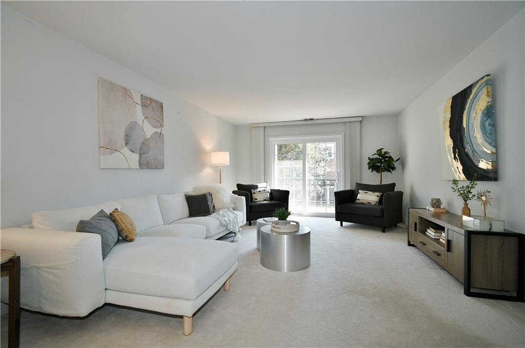 425 North Neville Street, Unit 204 Pittsburgh, PA 15213 - Photo 12 of 38 a living room with furniture a fireplace and a potted plant
