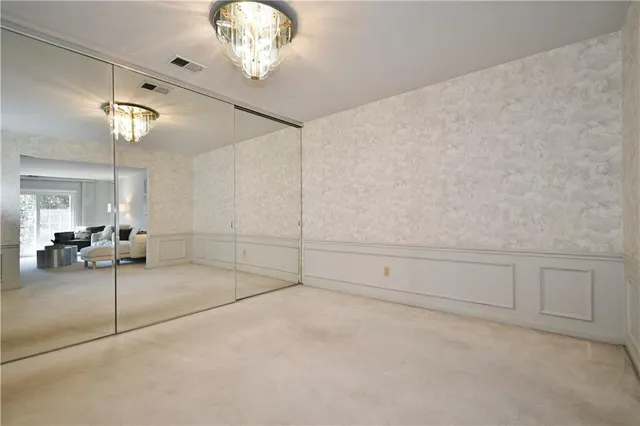 a view of a livingroom with furniture and chandelier