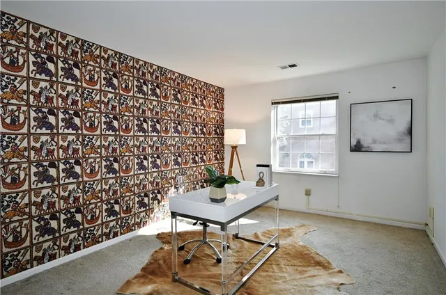 a living room with a table and a window