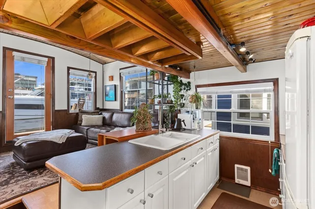 a kitchen with stainless steel appliances a refrigerator and a stove