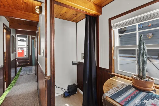 a view of living room with furniture and wooden floor