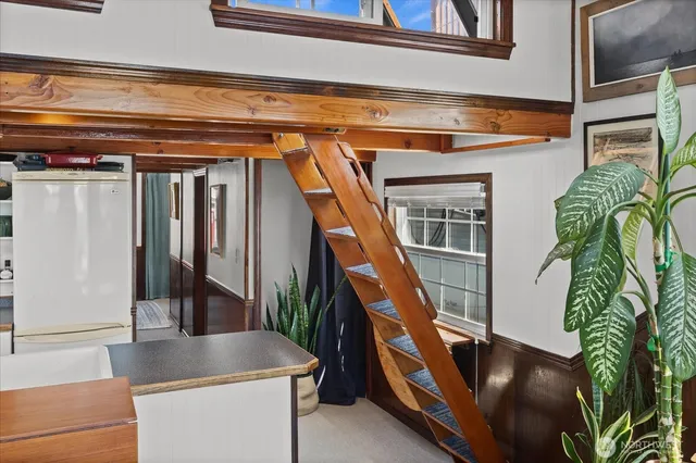 a living room with furniture rug and wooden floor