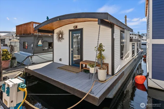 a front view of a house with sitting area