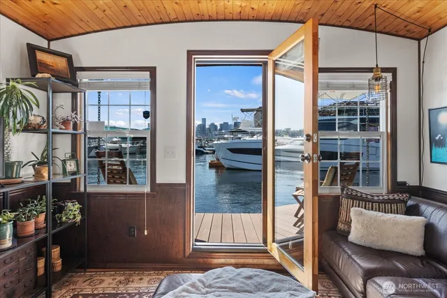 a view of a chairs and table in patio with a yard