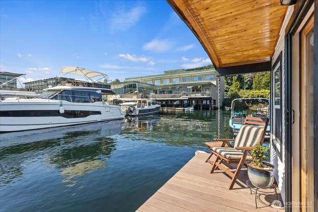 a view of a lake with chairs