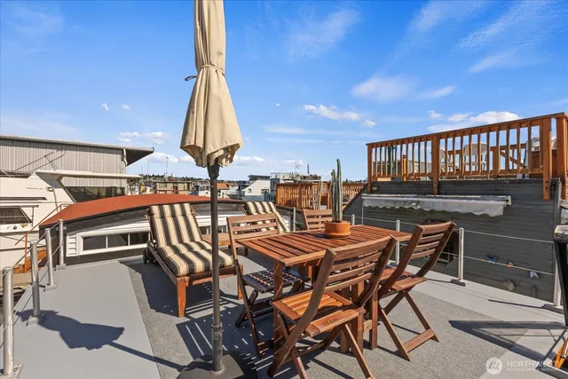 a view of a chairs and table in wooden roof