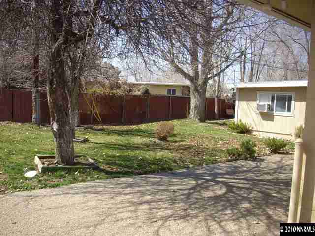 1865-7 Montello Street Reno, NV 89512 - Photo 3 of 9 a view of a house with a yard