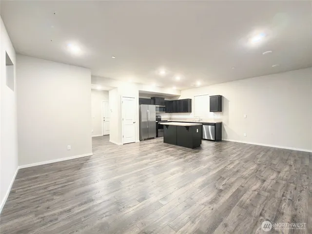 a view of kitchen with wooden floor