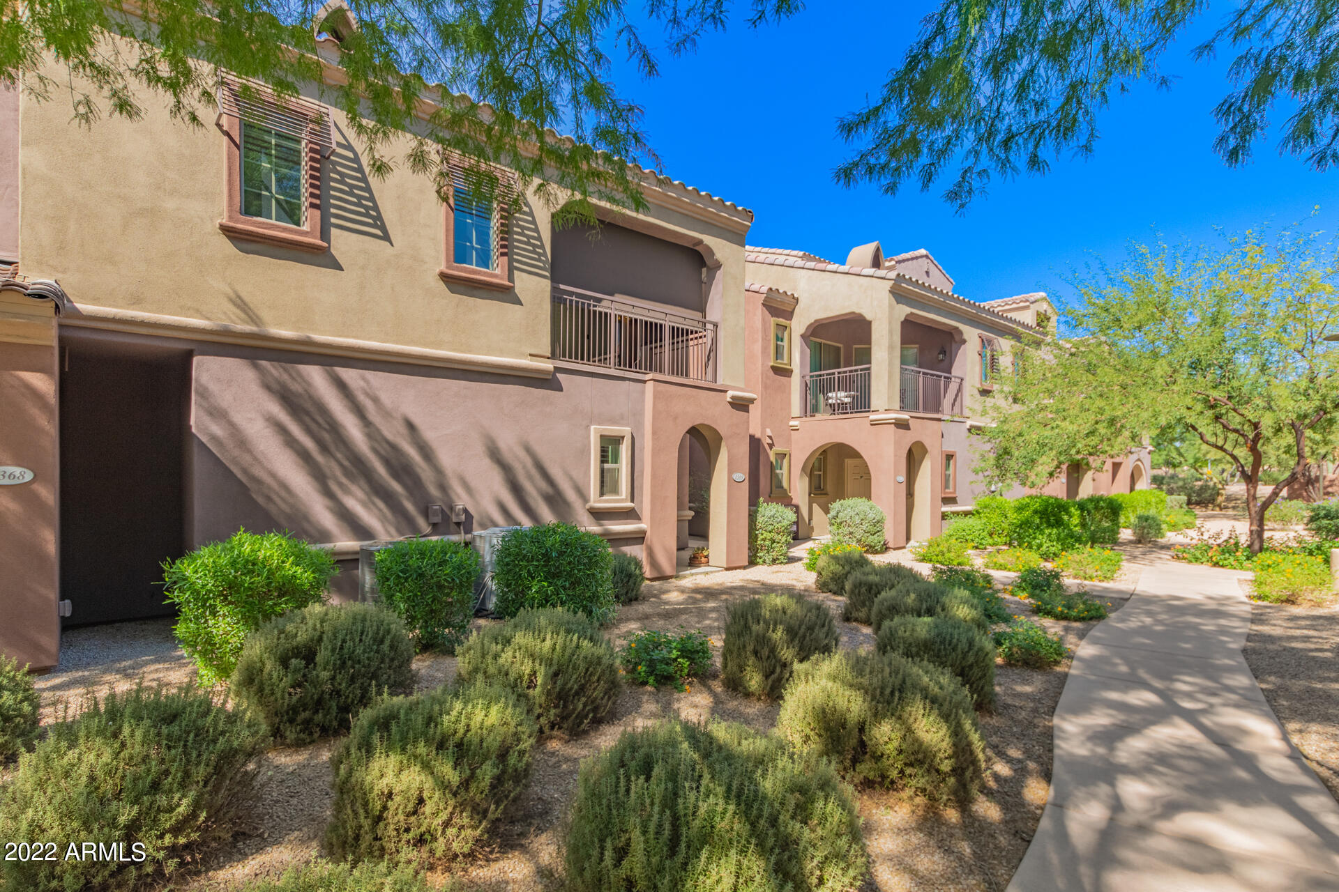 3935 East Rough Rider Road, Unit 1369 Phoenix, AZ 85050 - Photo 1 of 44 a view of a house with a yard