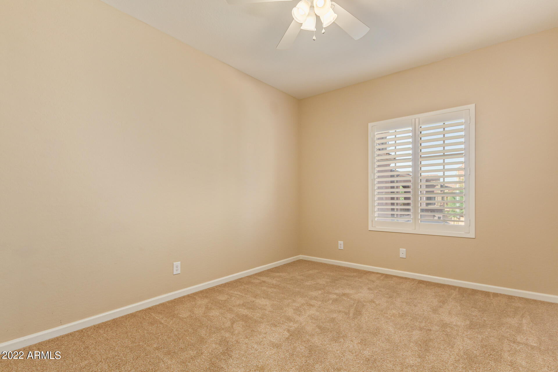 3935 East Rough Rider Road, Unit 1369 Phoenix, AZ 85050 - Photo 29 of 44 an empty room with a window