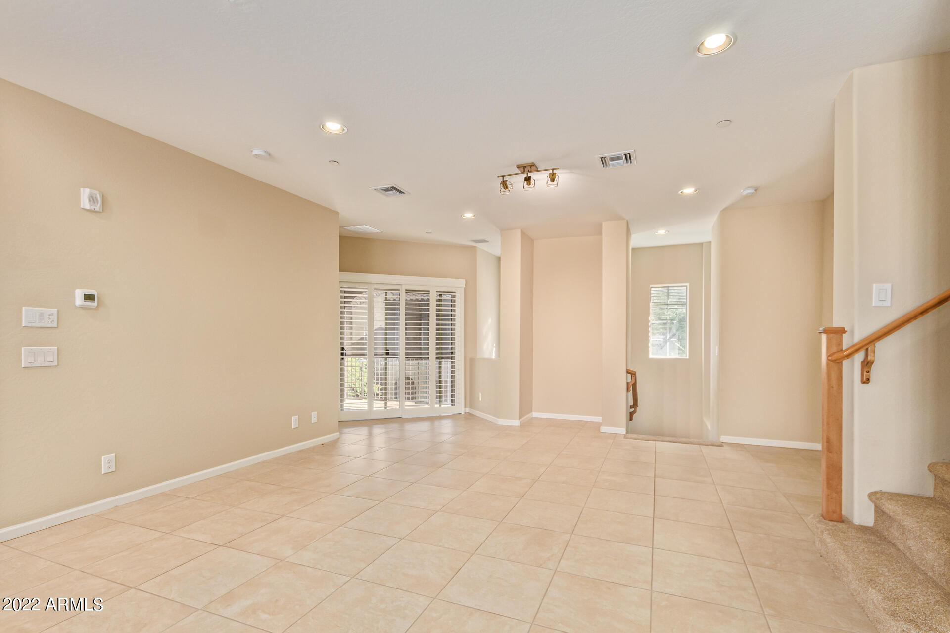 3935 East Rough Rider Road, Unit 1369 Phoenix, AZ 85050 - Photo 8 of 44 a view of an empty room