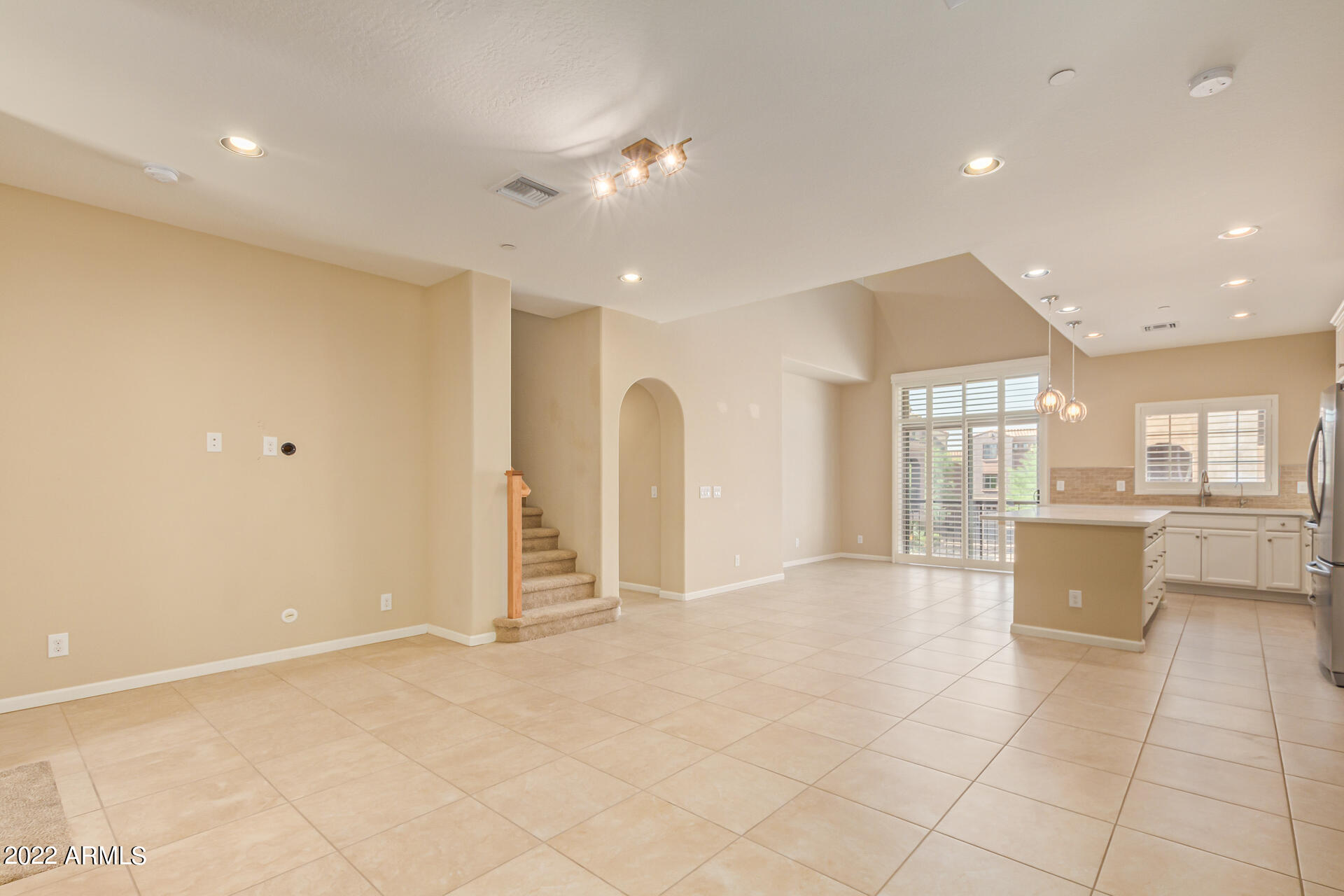 3935 East Rough Rider Road, Unit 1369 Phoenix, AZ 85050 - Photo 9 of 44 a view of a kitchen with furniture and a window