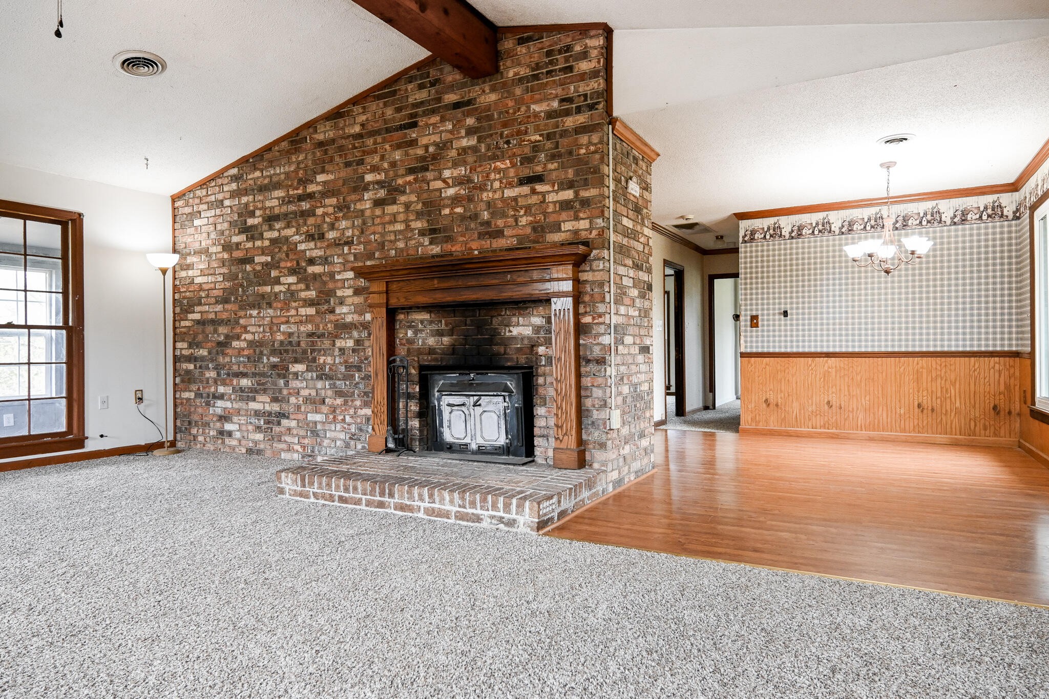 2464 No Pone Road Northwest Georgetown, TN 37336 - Photo 3 of 50 an empty room with a fireplace and wooden floor