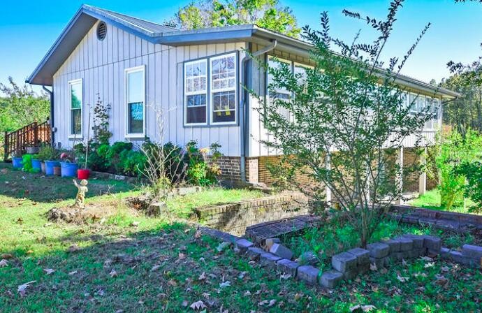 2464 No Pone Road Northwest Georgetown, TN 37336 - Photo 35 of 50 a view of a house with a yard and garden