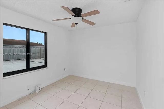 a kitchen with stainless steel appliances granite countertop a stove a microwave and a refrigerator