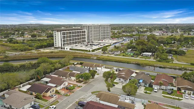 an aerial view of residential building and lake view