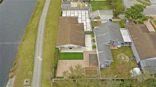 aerial view of a residential apartment building with a yard