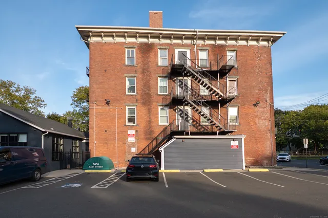 a view of a street with cars