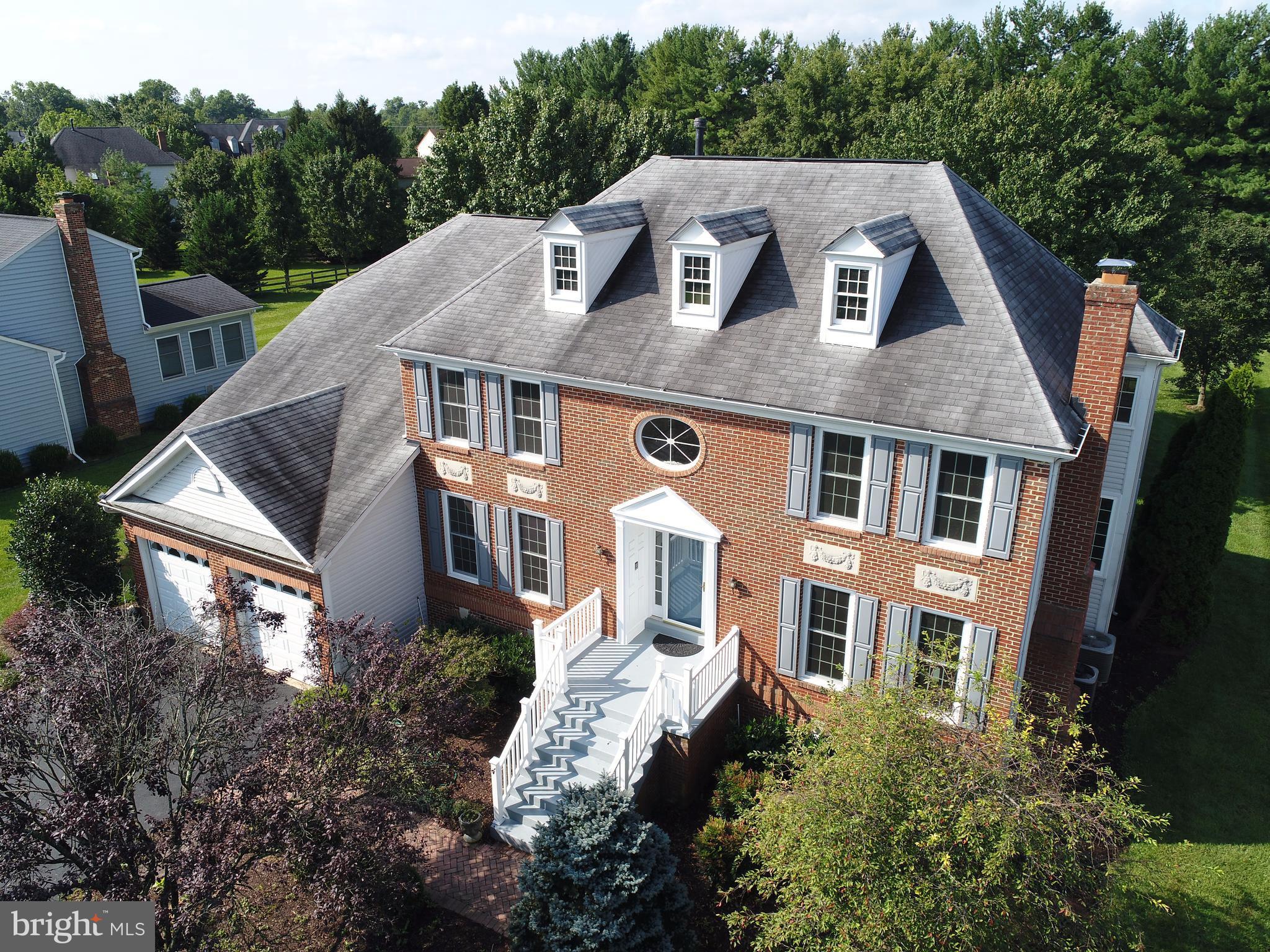 17106 Campbell Farm Road Poolesville, MD 20837 - Photo 1 of 30 a aerial view of a house next to a yard