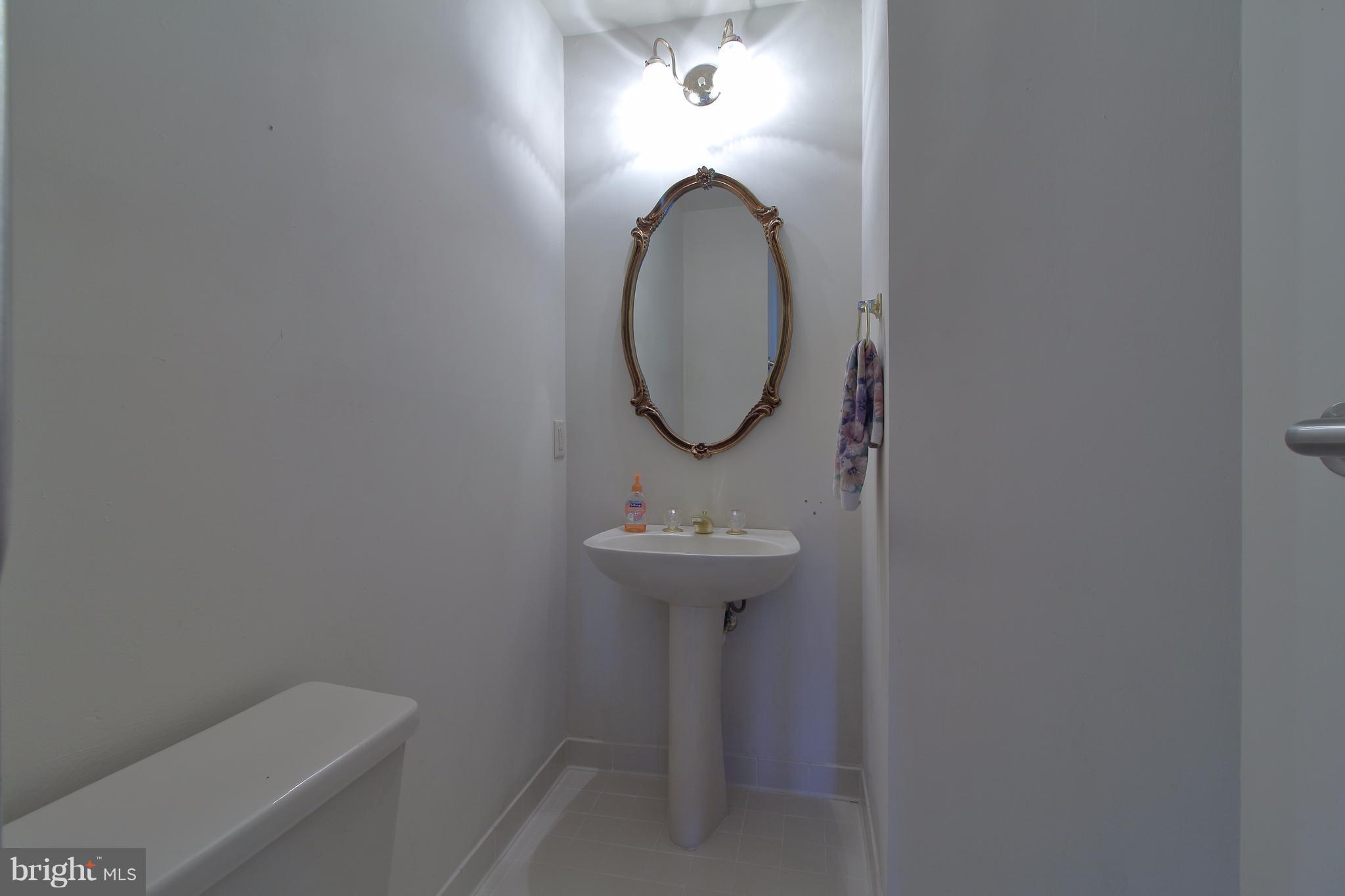 17106 Campbell Farm Road Poolesville, MD 20837 - Photo 13 of 30 a bathroom with a sink and a mirror