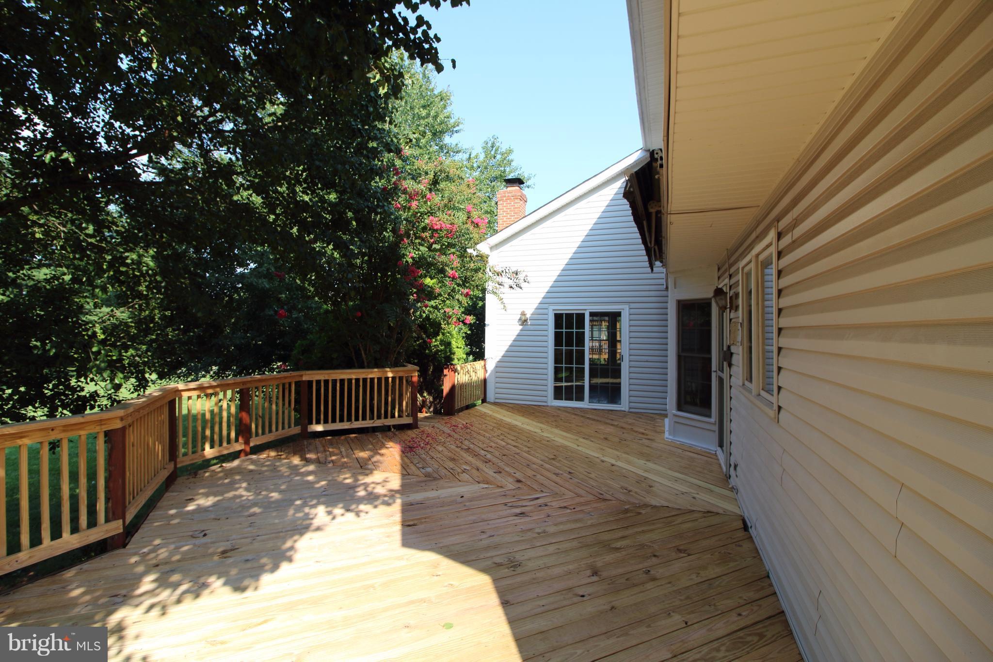 17106 Campbell Farm Road Poolesville, MD 20837 - Photo 18 of 30 a view of a backyard with wooden fence and large trees