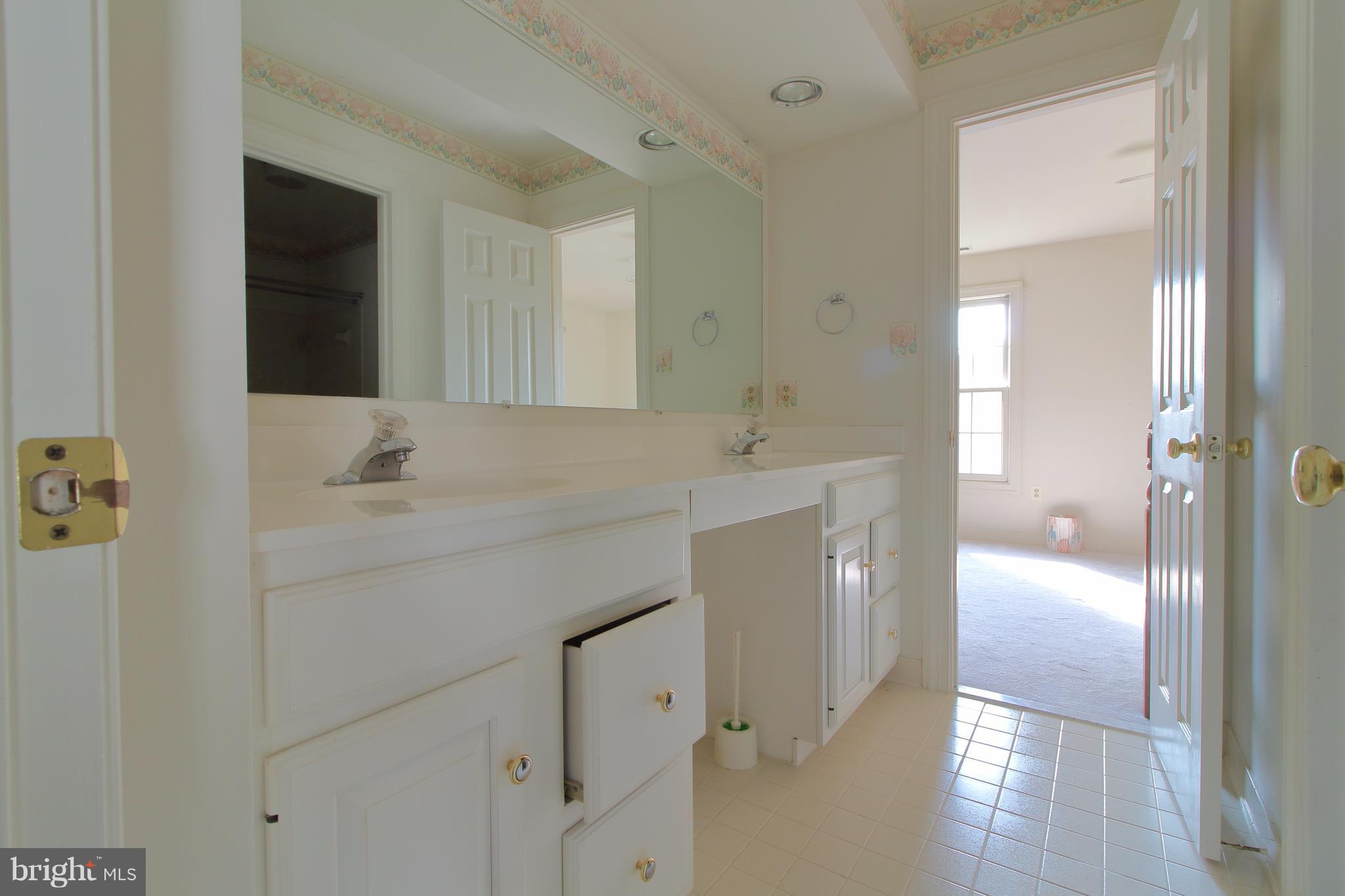 17106 Campbell Farm Road Poolesville, MD 20837 - Photo 24 of 30 a bathroom with a sink and a mirror