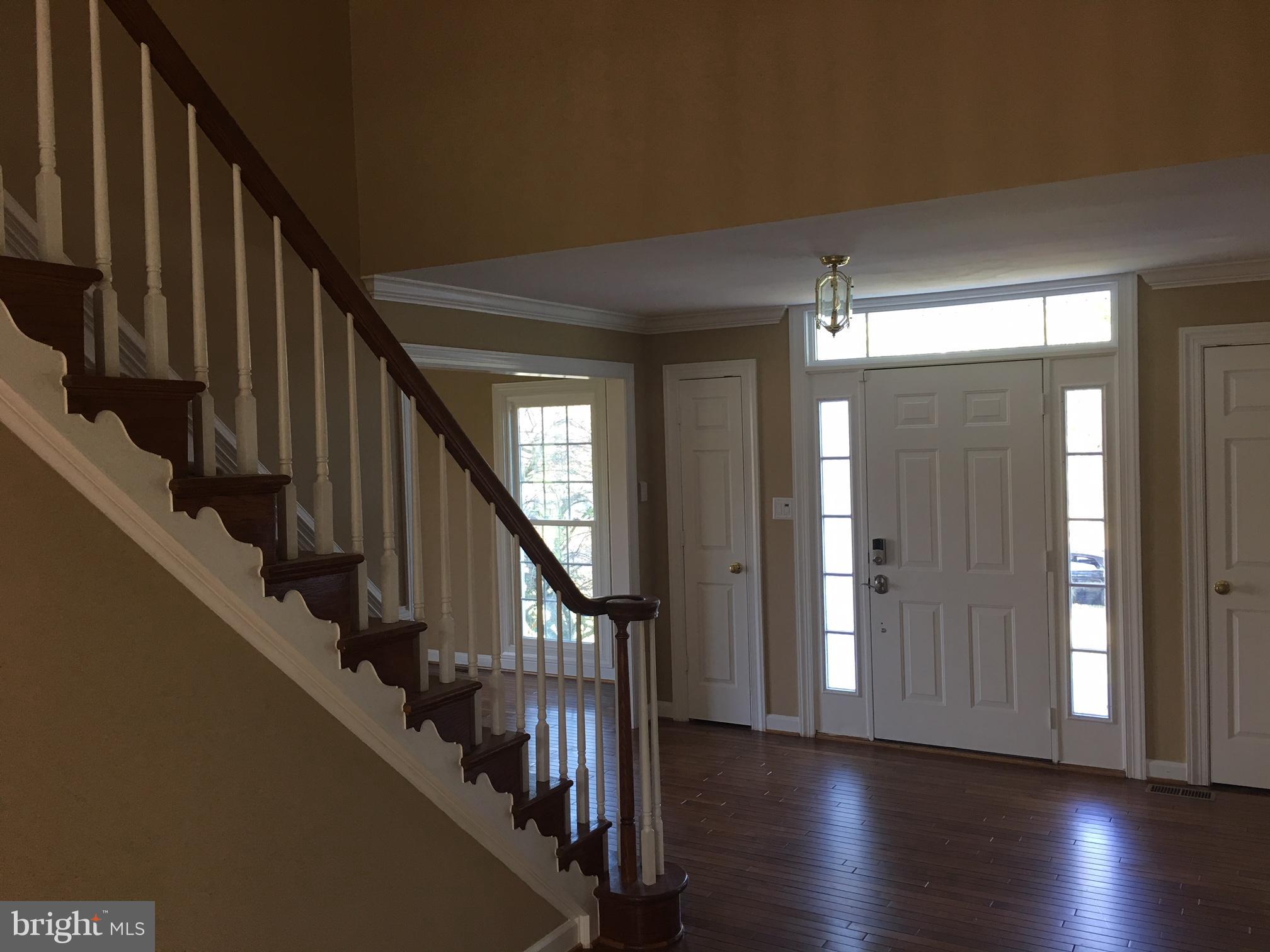 17106 Campbell Farm Road Poolesville, MD 20837 - Photo 5 of 30 a view of an entryway wooden floor and stairs