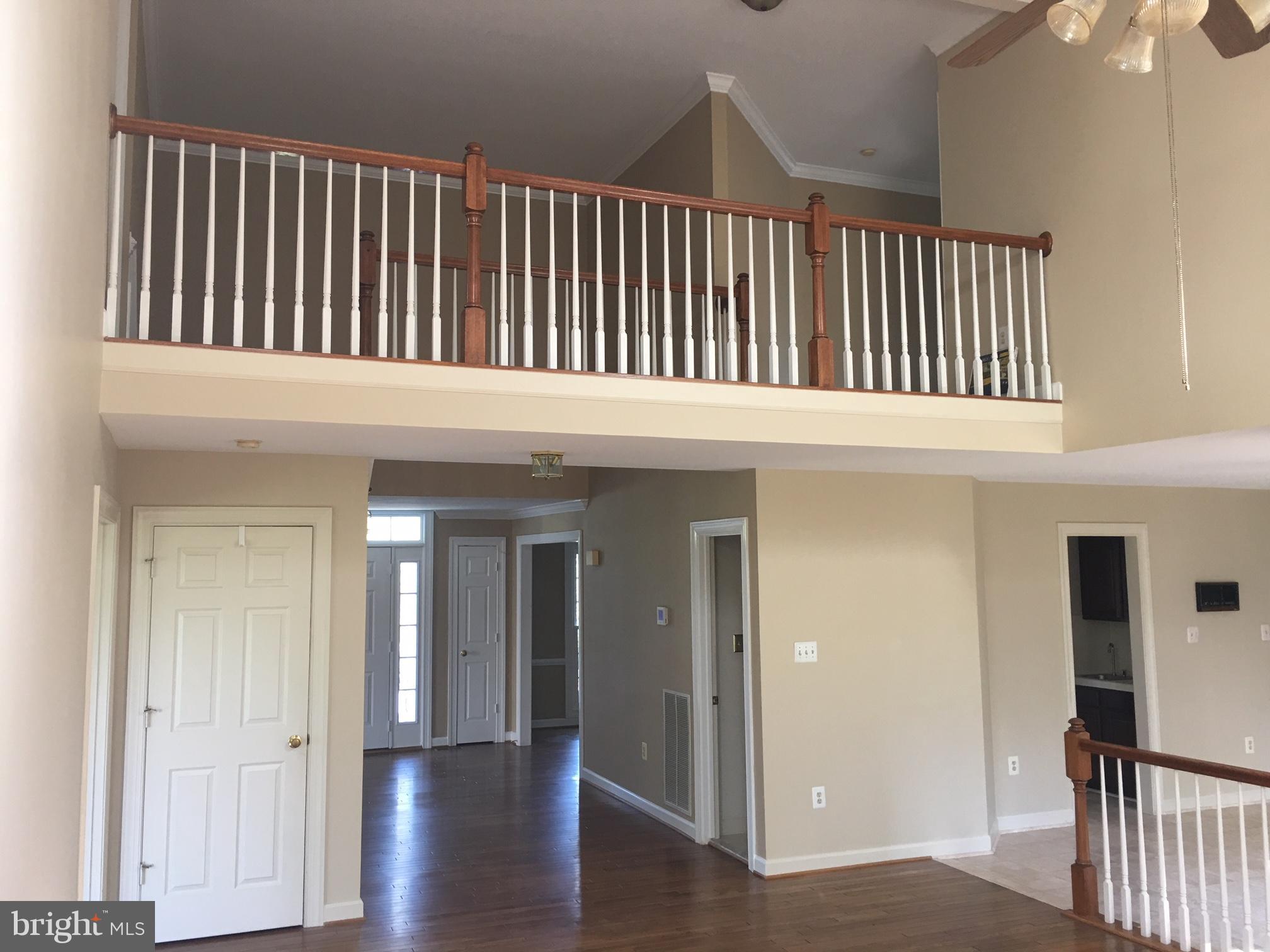 17106 Campbell Farm Road Poolesville, MD 20837 - Photo 10 of 30 a balcony view with a hallway