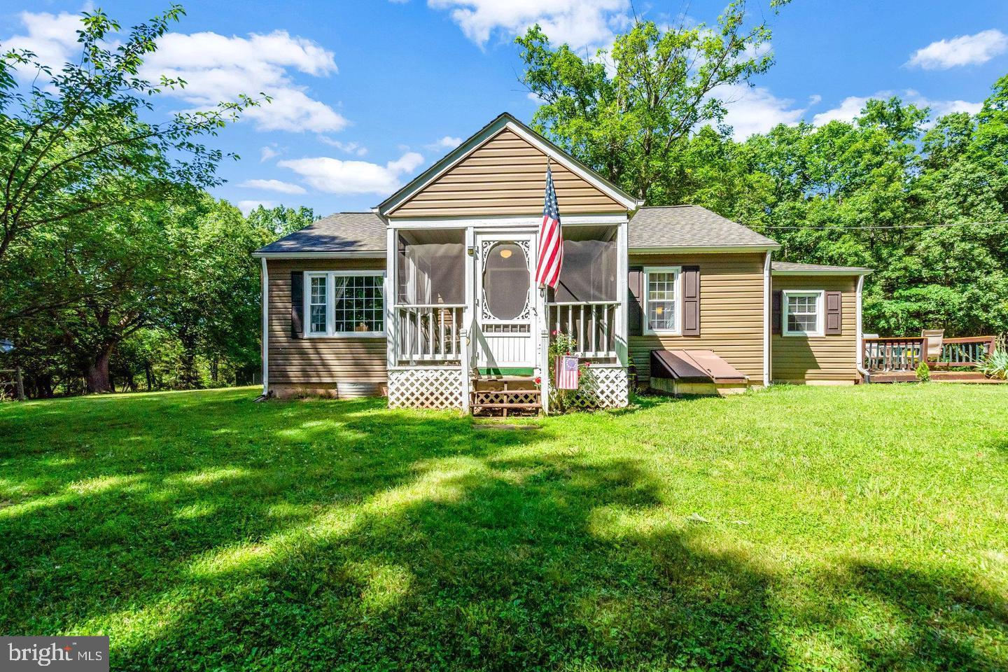 4440 Dumfries Road Catlett, VA 20119 - Photo 1 of 38 a front view of a house with a garden