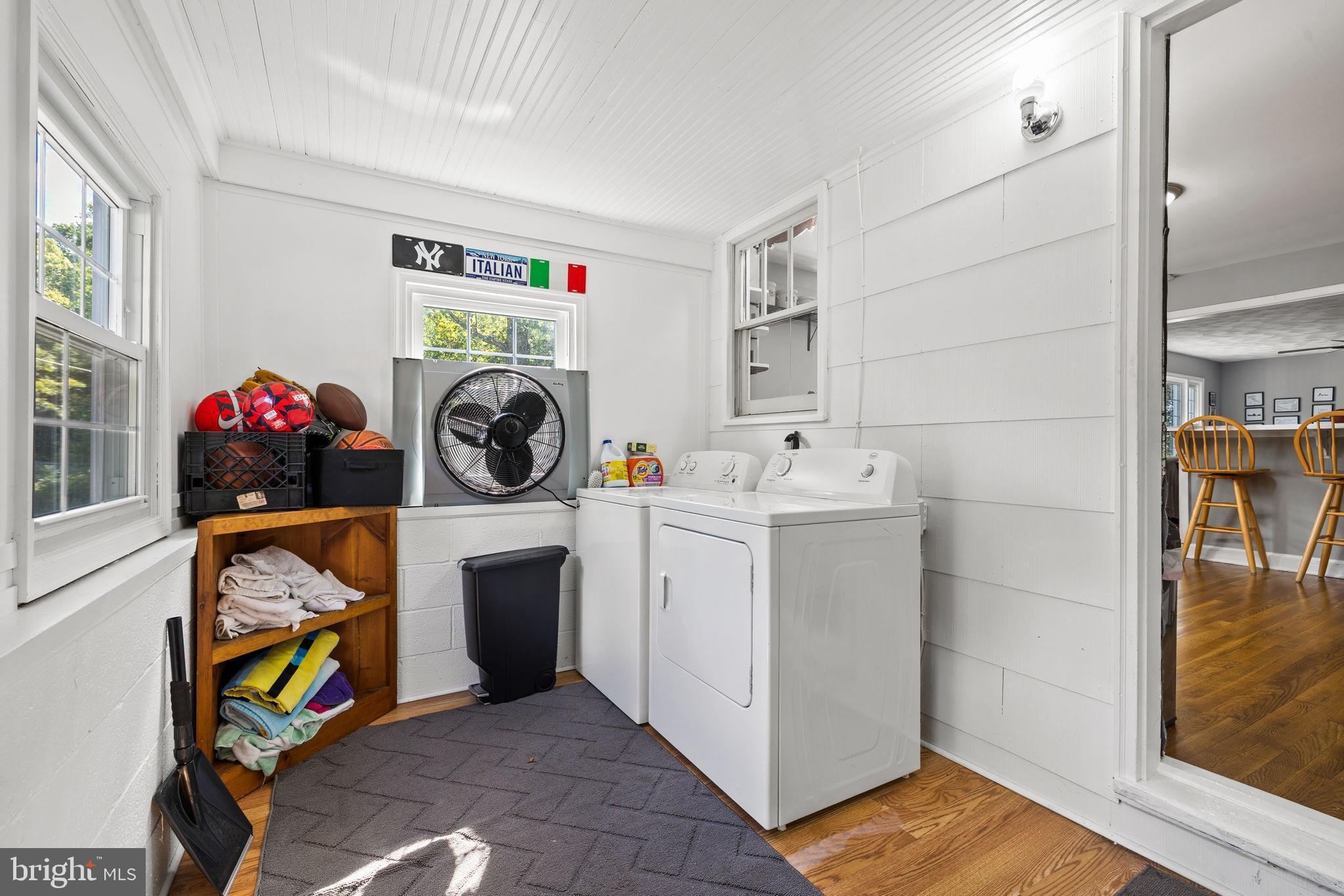 4440 Dumfries Road Catlett, VA 20119 - Photo 12 of 38 a utility room with dryer washer and a view of living room