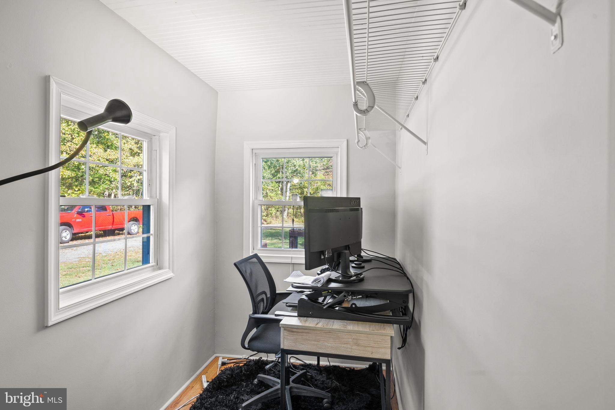 4440 Dumfries Road Catlett, VA 20119 - Photo 16 of 38 a view of a workspace with furniture and a window