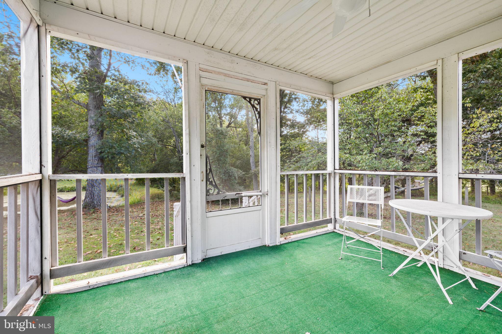 4440 Dumfries Road Catlett, VA 20119 - Photo 23 of 38 a view of a deck with a tv and a yard