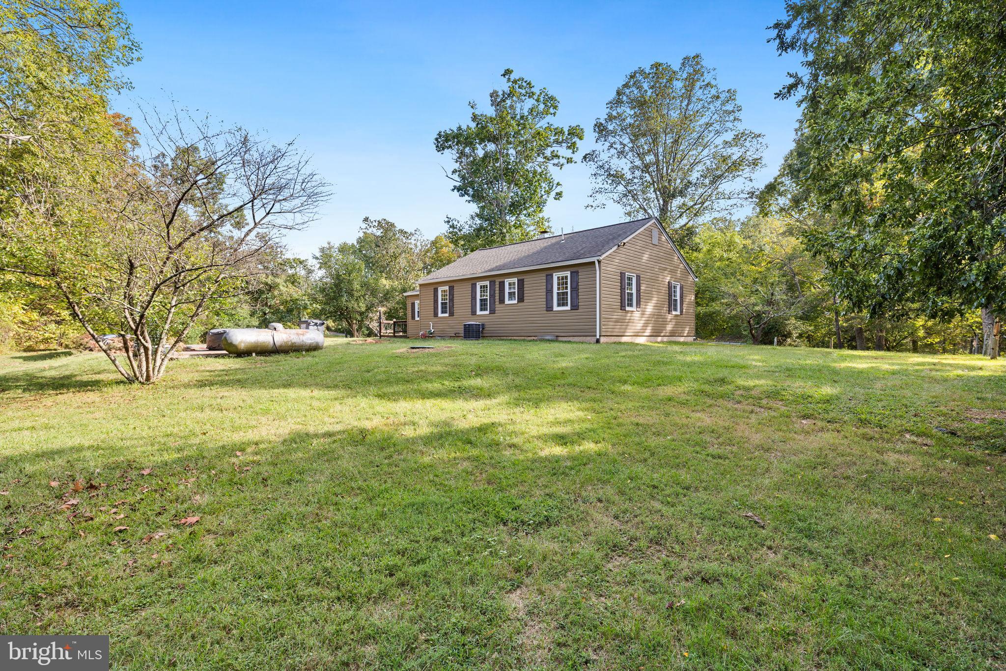 4440 Dumfries Road Catlett, VA 20119 - Photo 26 of 38 a view of a house with yard and trees in the background