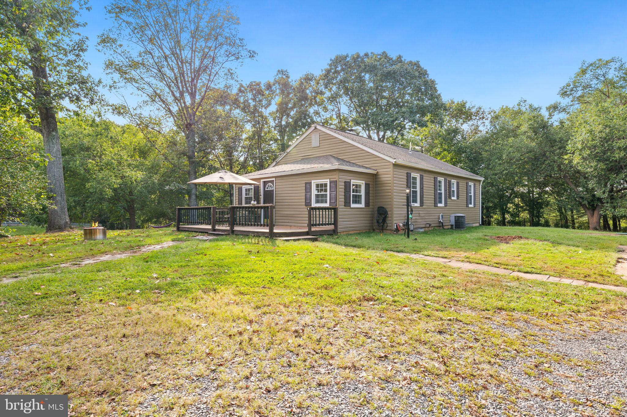 4440 Dumfries Road Catlett, VA 20119 - Photo 3 of 38 a front view of a house with swimming pool and porch