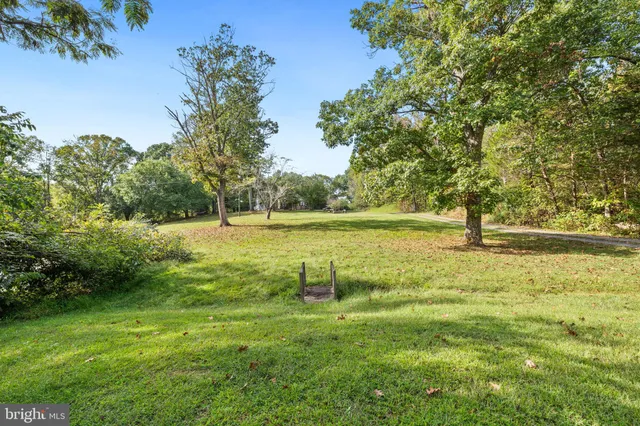 a view of a swimming pool with a yard