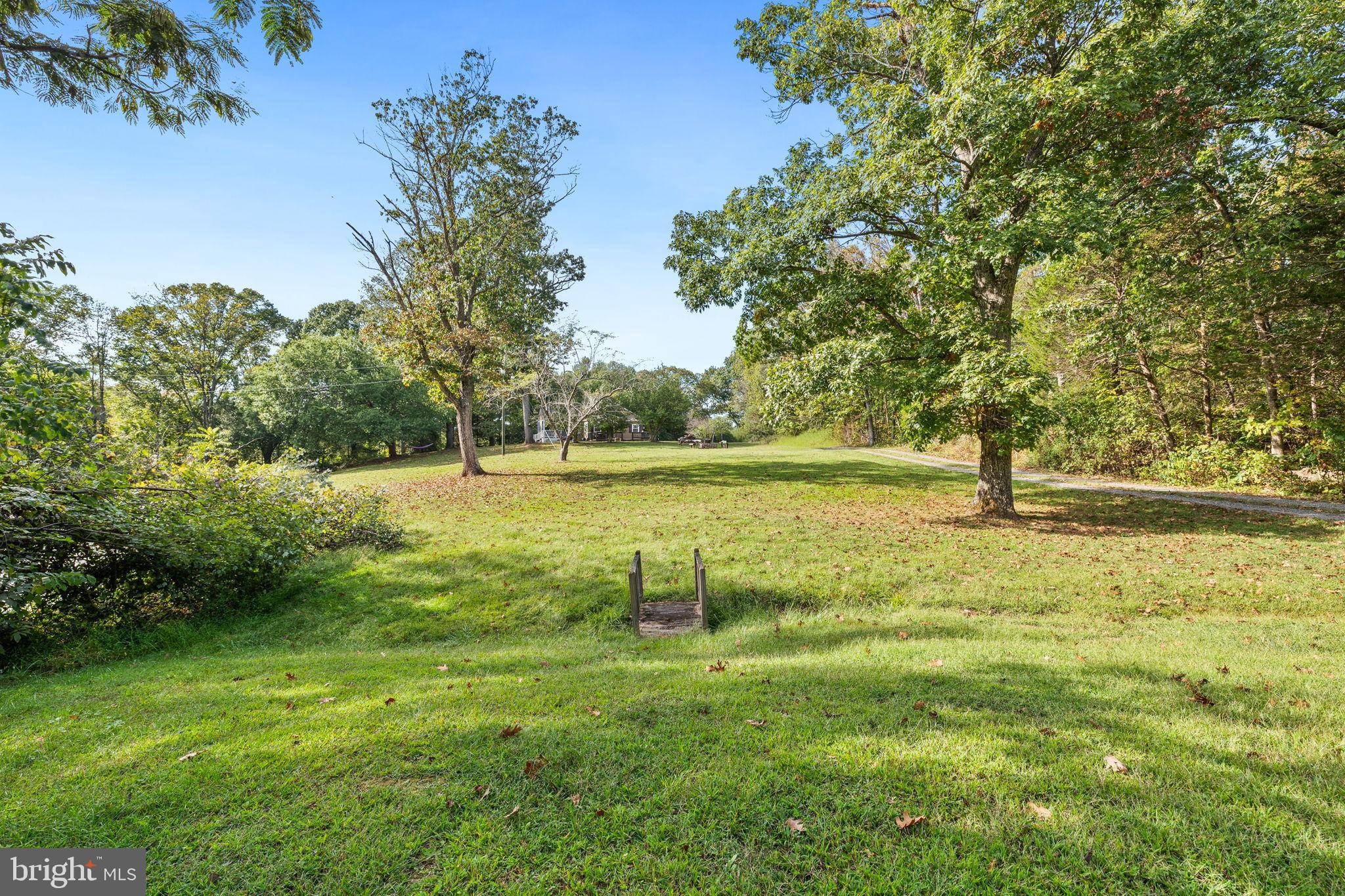 4440 Dumfries Road Catlett, VA 20119 - Photo 33 of 38 a view of a lake with a yard