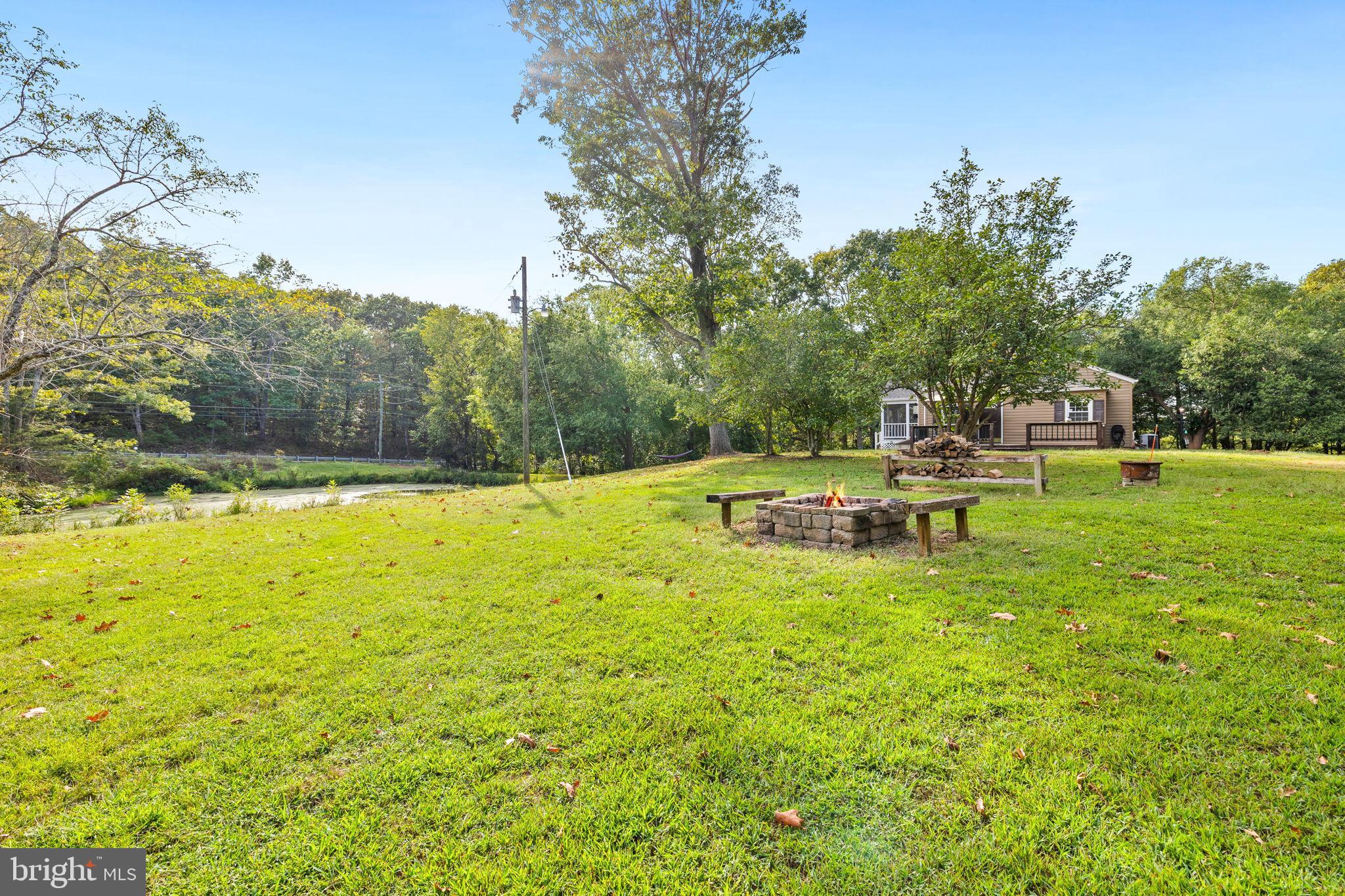 4440 Dumfries Road Catlett, VA 20119 - Photo 34 of 38 a view of a swimming pool with a yard